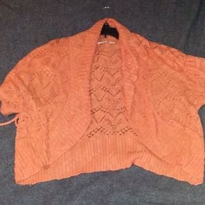 Cute little orange knitted jacket